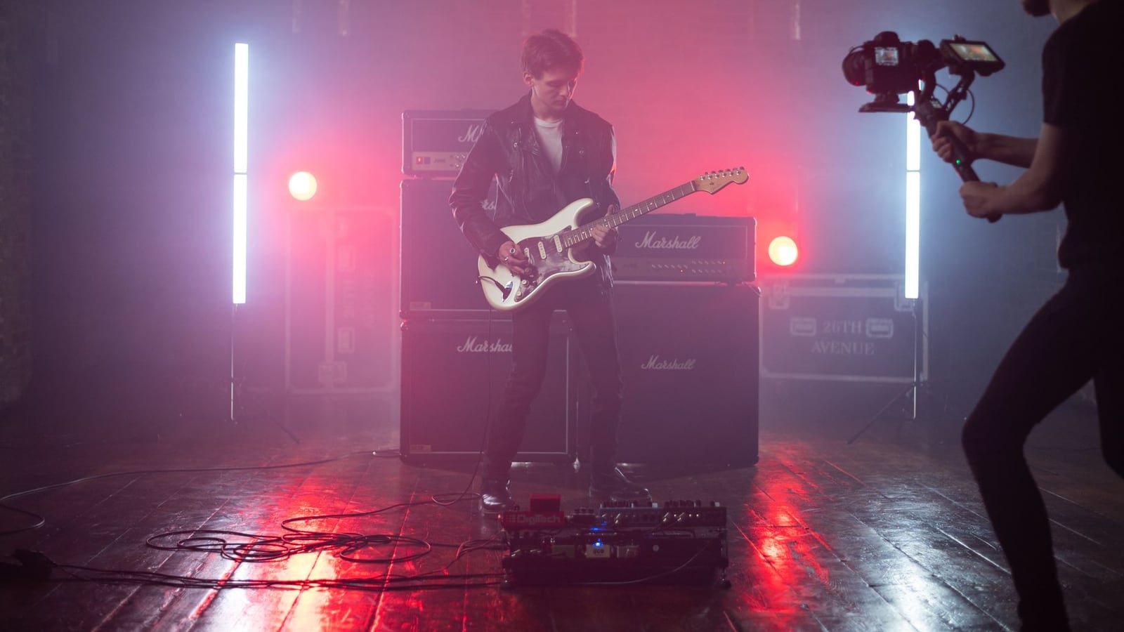 Music video shoot in urban Nagoya with dramatic lighting and professional stabilization